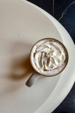 hot cocoa with whip cream in a mug