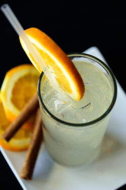 Mocktail with ice from above with Cinnamon and orange slices