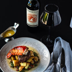 Surf and turf with wine bottle and wine glass