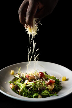 Sprinkle of cheese over salad